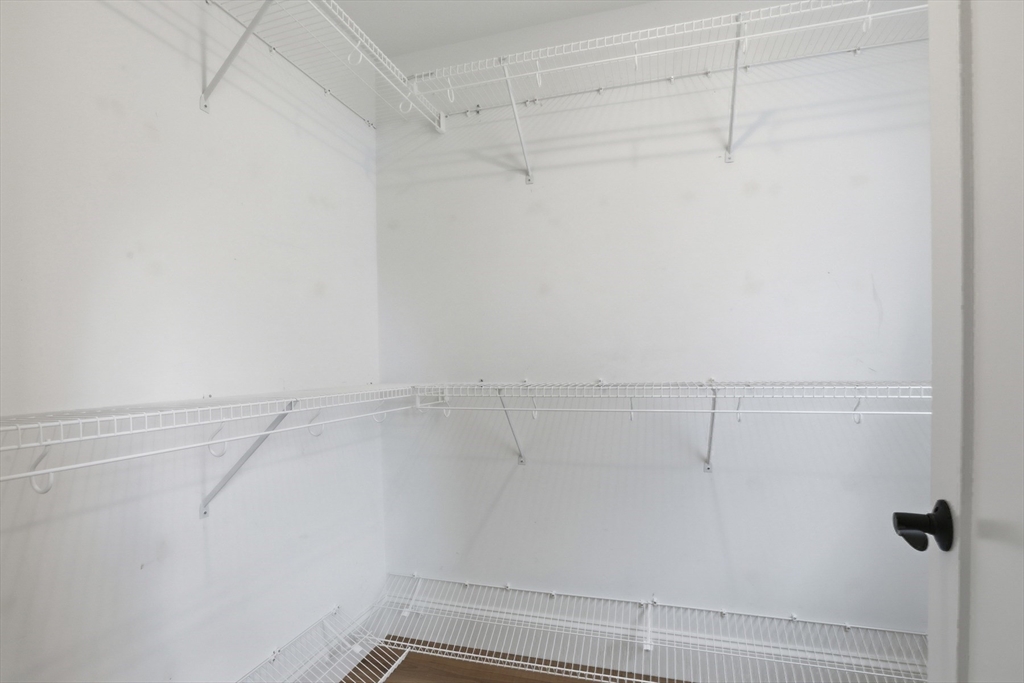 47 Cutter Lane, Unit 47 Amesbury, MA 01913 - Photo 19 of 33 a view of a room with racks on the wall