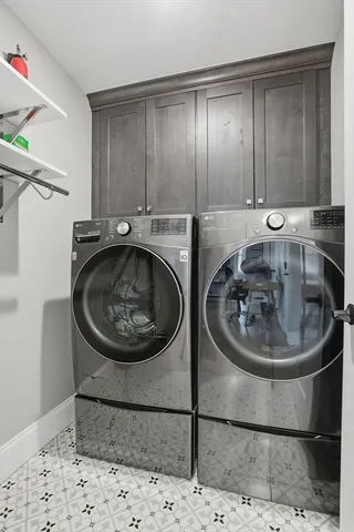 a utility room with a sink a washer and dryer