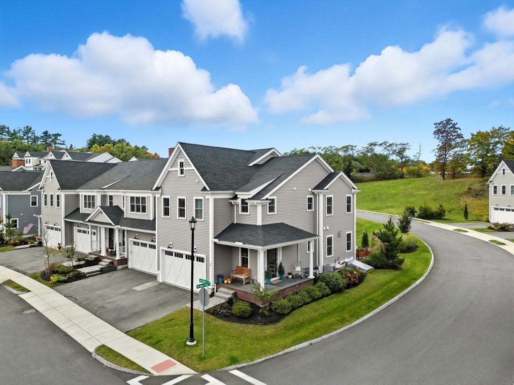 47 Cutter Lane, Unit 47 Amesbury, MA 01913 - Photo 33 of 33 an aerial view of a house with a big yard