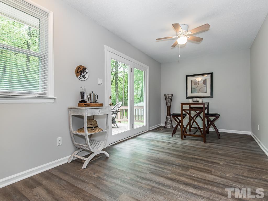7014 Kemp Road Raleigh, NC 27613 - Photo 12 of 43 a view of a workspace with furniture and a window