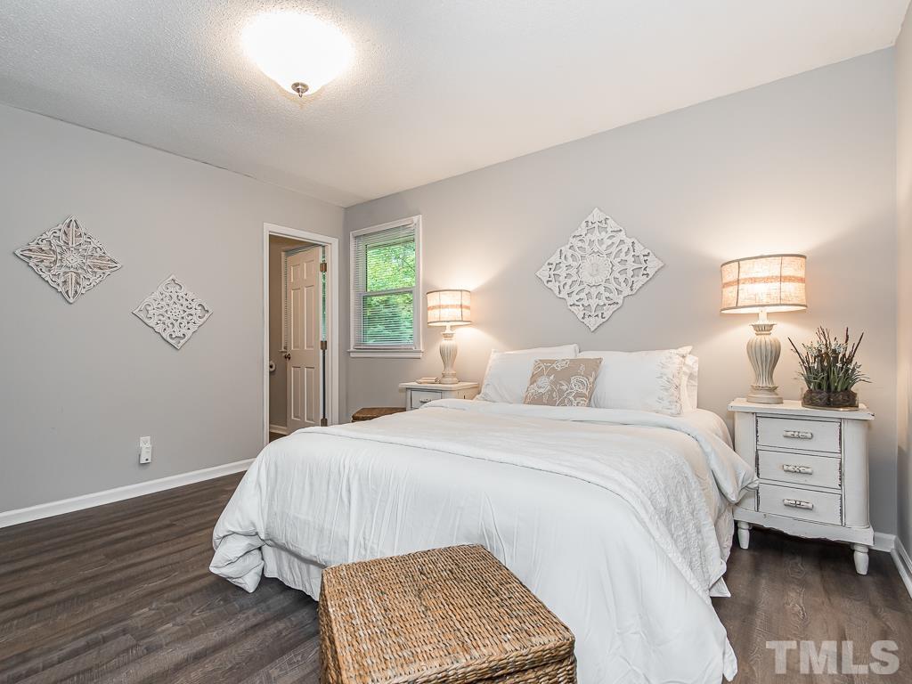 7014 Kemp Road Raleigh, NC 27613 - Photo 20 of 43 a bedroom with a bed and a window