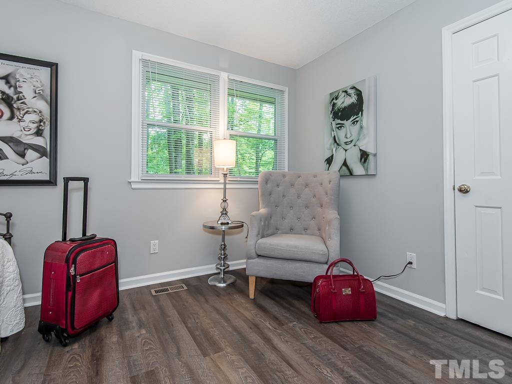 7014 Kemp Road Raleigh, NC 27613 - Photo 23 of 43 a living room with furniture and a window