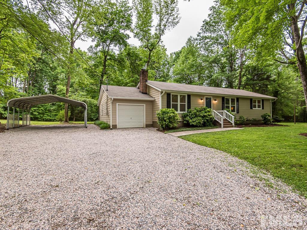 7014 Kemp Road Raleigh, NC 27613 - Photo 28 of 43 a front view of a house with garden