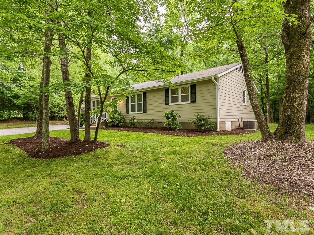7014 Kemp Road Raleigh, NC 27613 - Photo 32 of 43 a view of a backyard with large trees