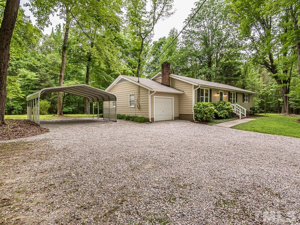 7014 Kemp Road Raleigh, NC 27613 - Photo 34 of 43 a front view of a house with garden