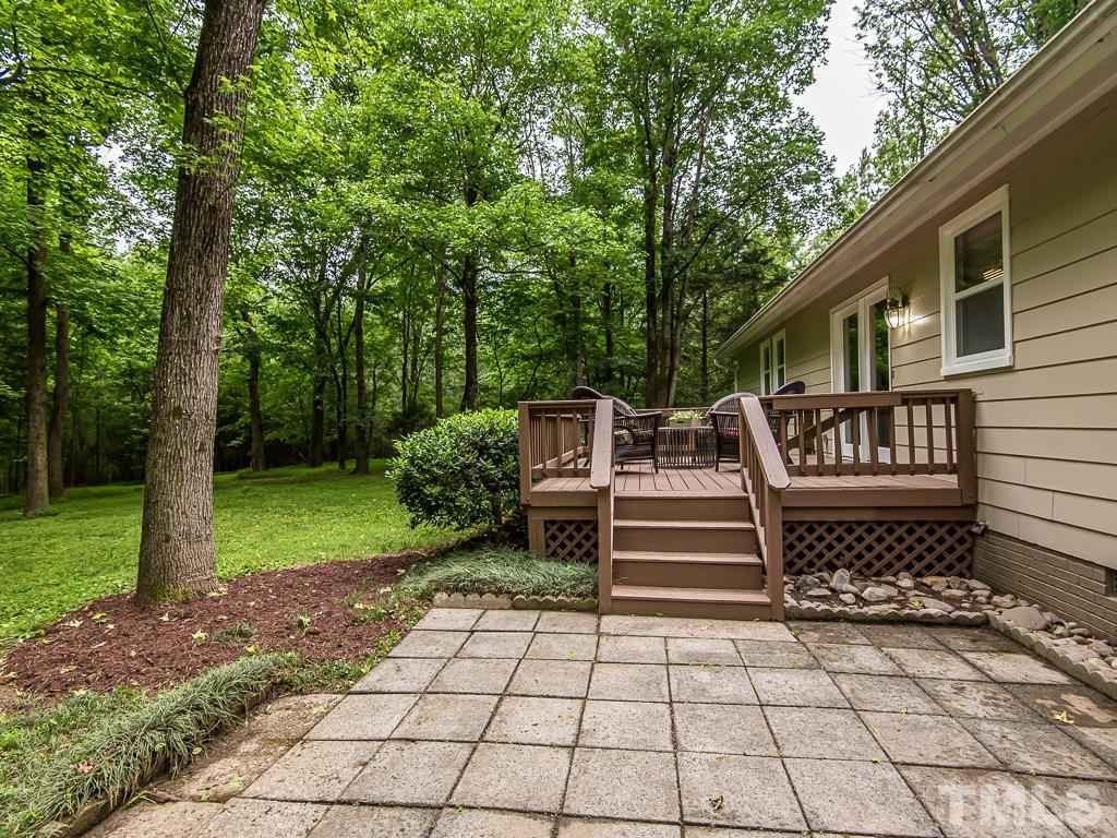 7014 Kemp Road Raleigh, NC 27613 - Photo 35 of 43 a front view of a house with a garden