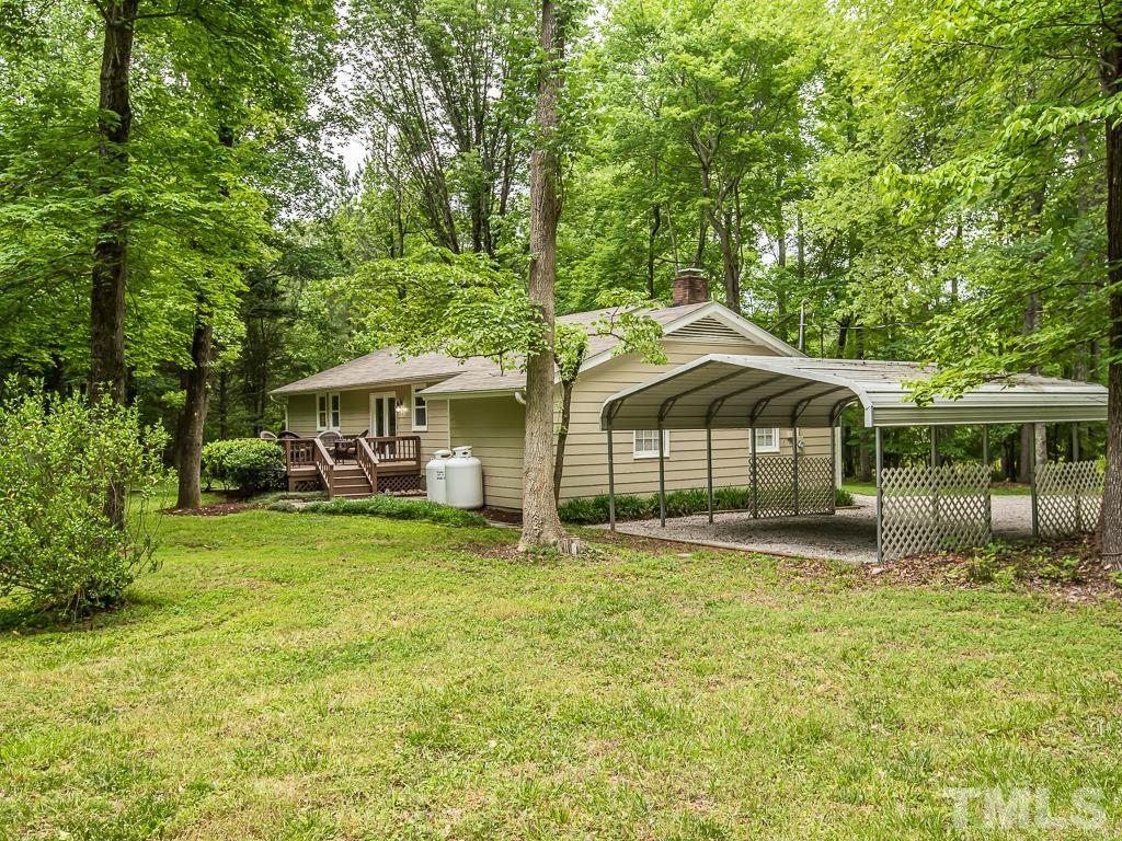 7014 Kemp Road Raleigh, NC 27613 - Photo 40 of 43 a front view of a house with a garden