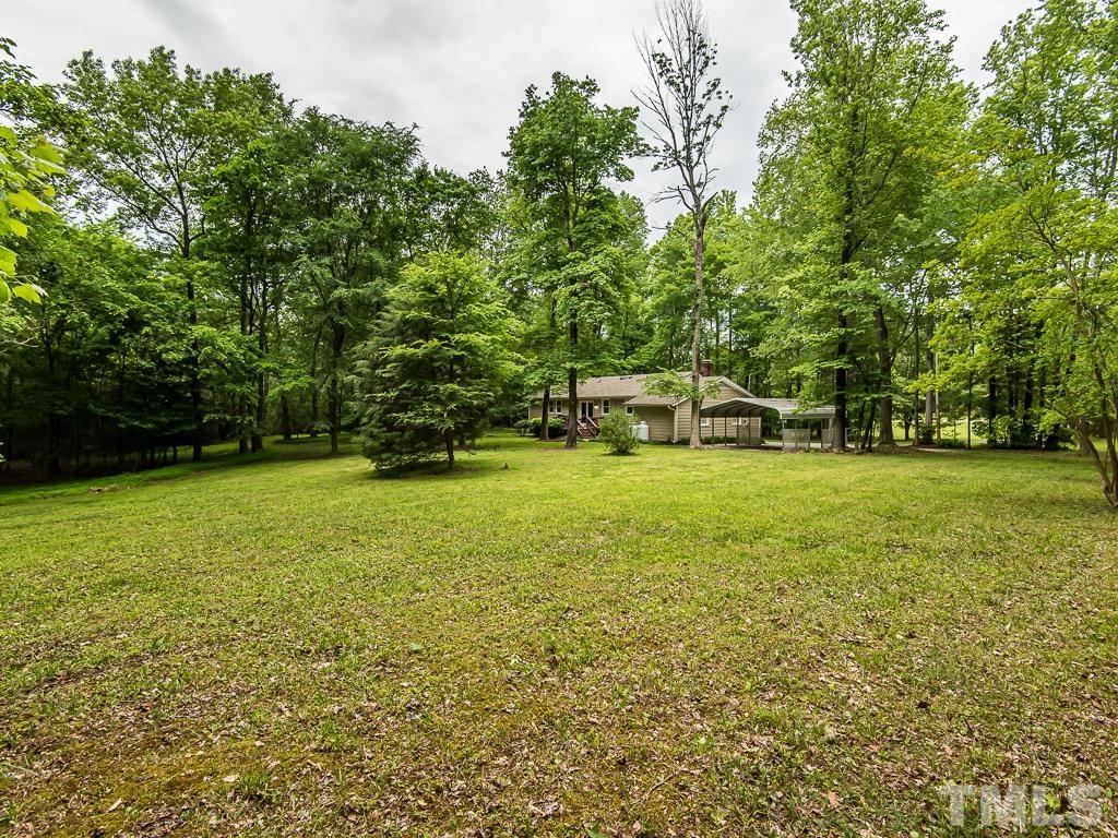 7014 Kemp Road Raleigh, NC 27613 - Photo 41 of 43 a view of a house with a yard