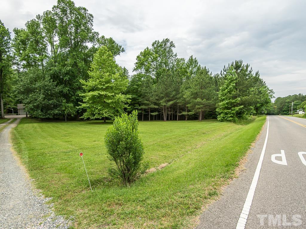 7014 Kemp Road Raleigh, NC 27613 - Photo 42 of 43 a view of a garden with a large tree