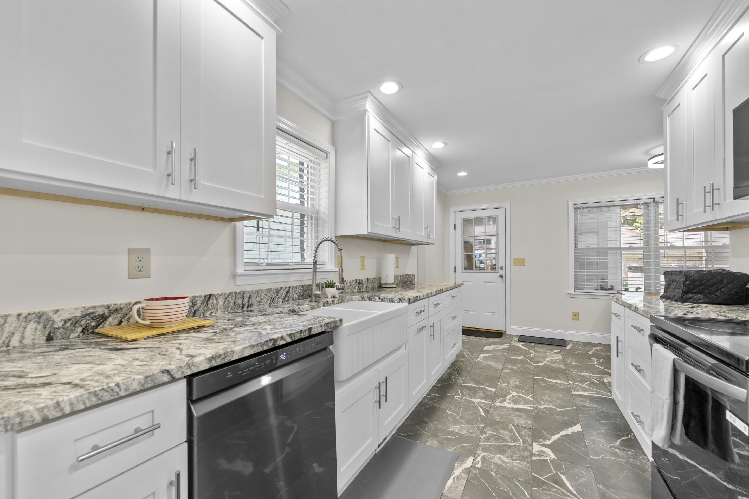 2218 Riverdale Road Germantown, TN 38138 - Photo 8 of 40 Thoughtfully redesigned kitchen with extensive counter space, updated cabinetry, and a functional layout ideal for meal preparation and entertaining.