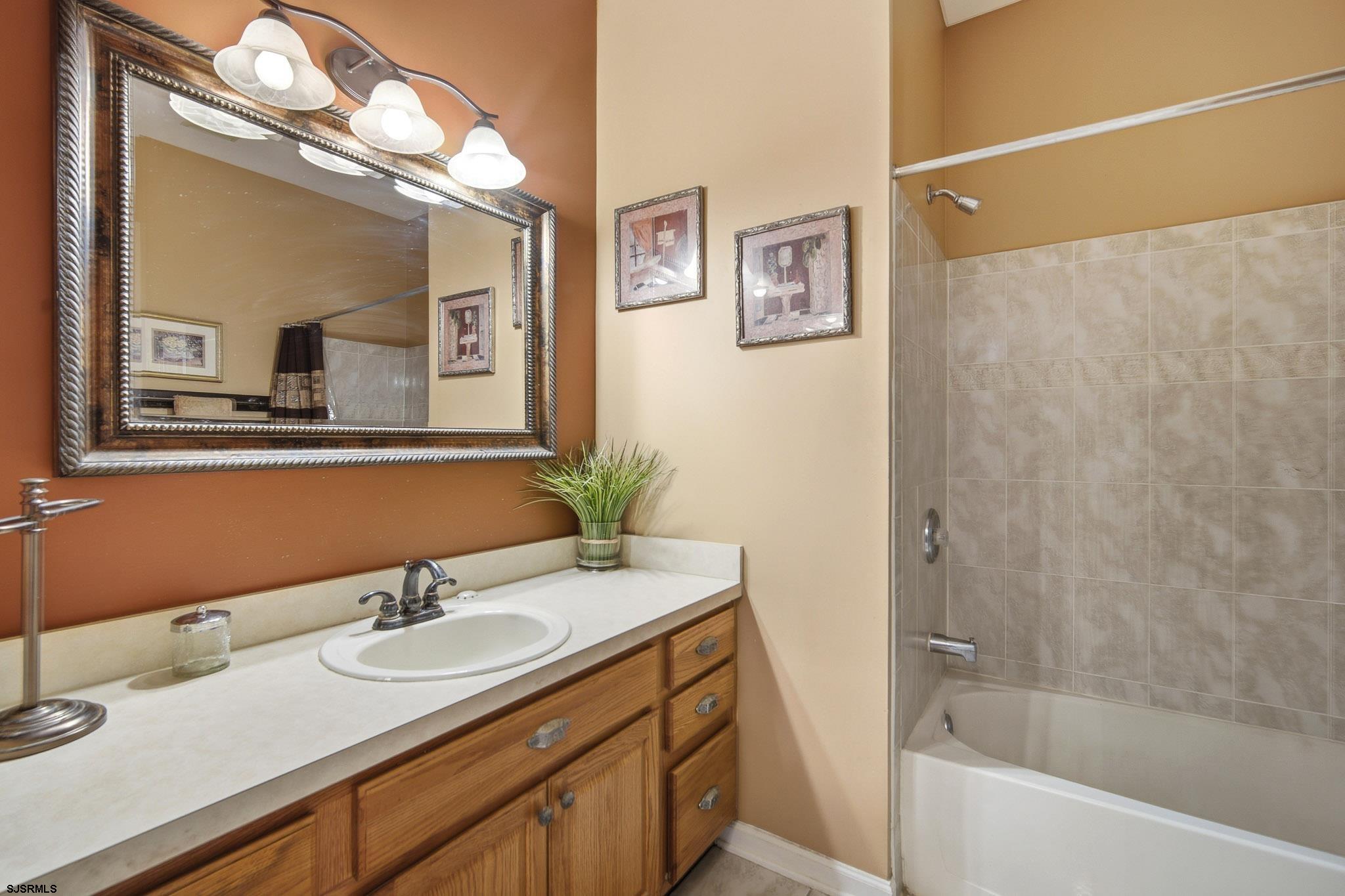 102 Warwick Road Galloway Township, NJ 08205 - Photo 23 of 45 a bathroom with a sink and a mirror