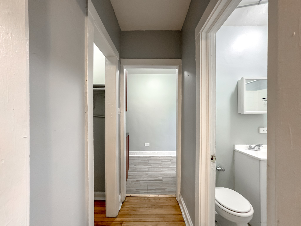 4606 North Beacon Street, Unit 2C Chicago, IL 60640 - Photo 18 of 21 a bathroom with a vanity and a toilet