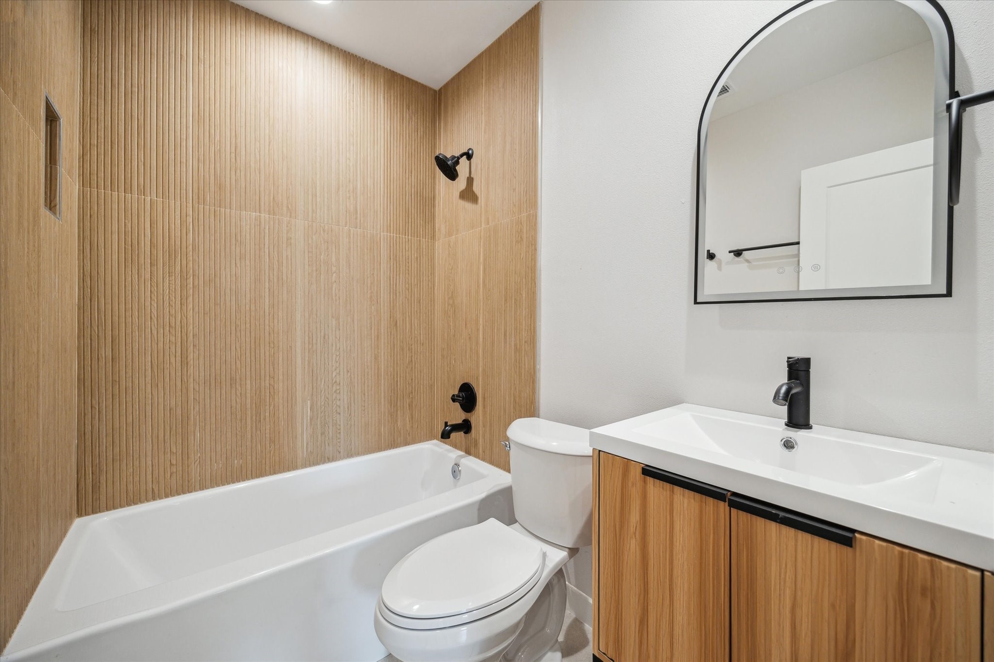 3902 Zina Way Houston, TX 77018 - Photo 19 of 48 a bathroom with a sink a toilet and shower curtain