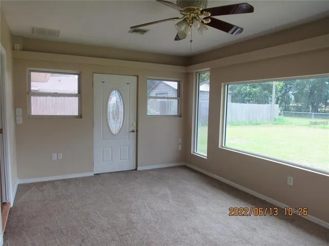 a view of an empty room with a window
