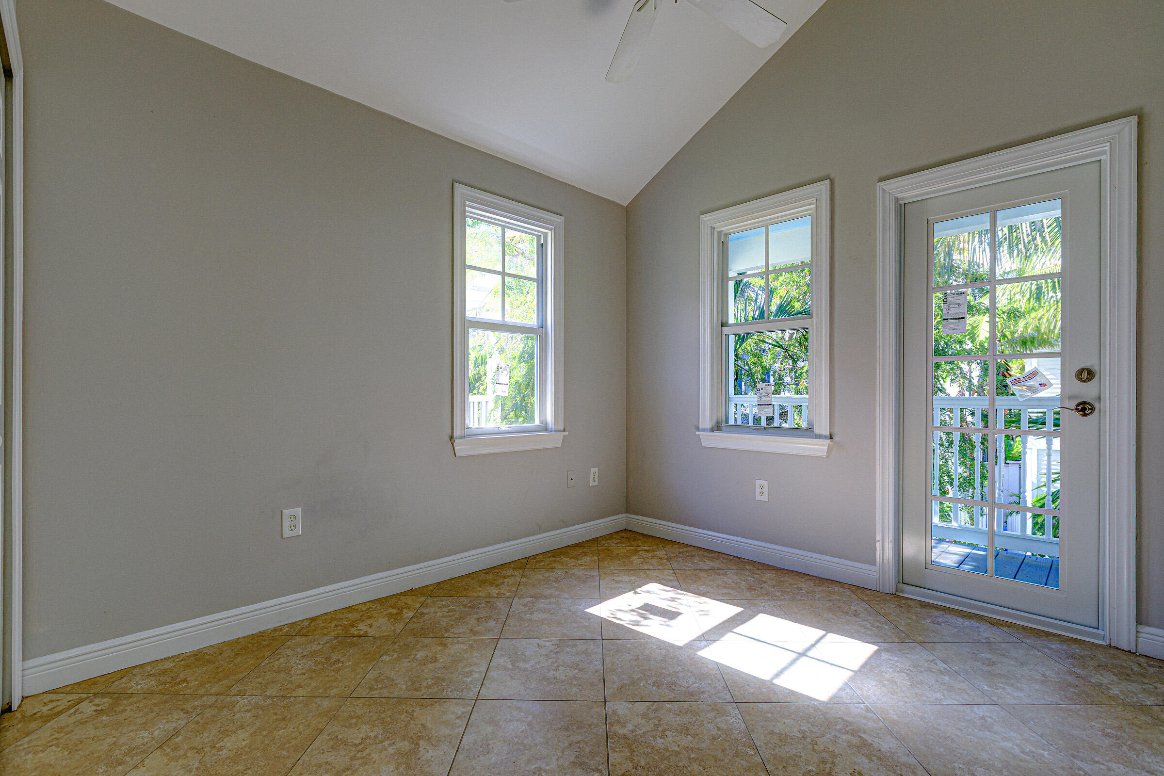 249 Golf Club Drive Key West, FL 33040 - Photo 8 of 11 an empty room with windows