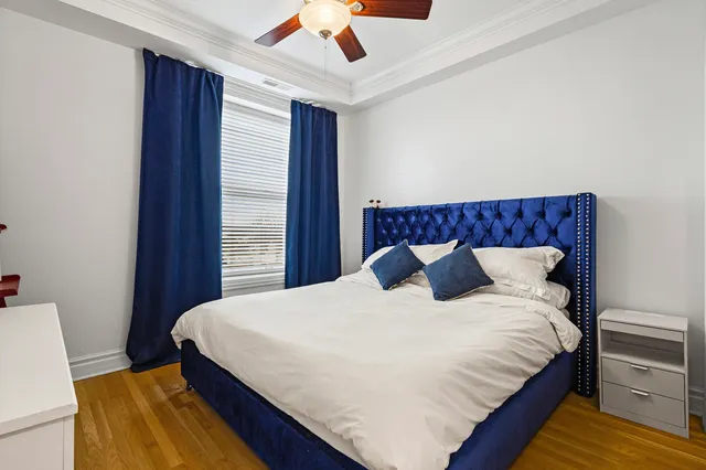 a bedroom with a bed and a book shelf