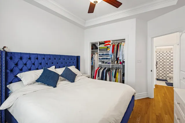 a bedroom with a bed and a book shelf
