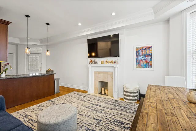 a living room with furniture and a kitchen view