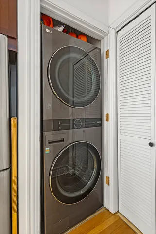 a large bed sitting in a bedroom next to a window