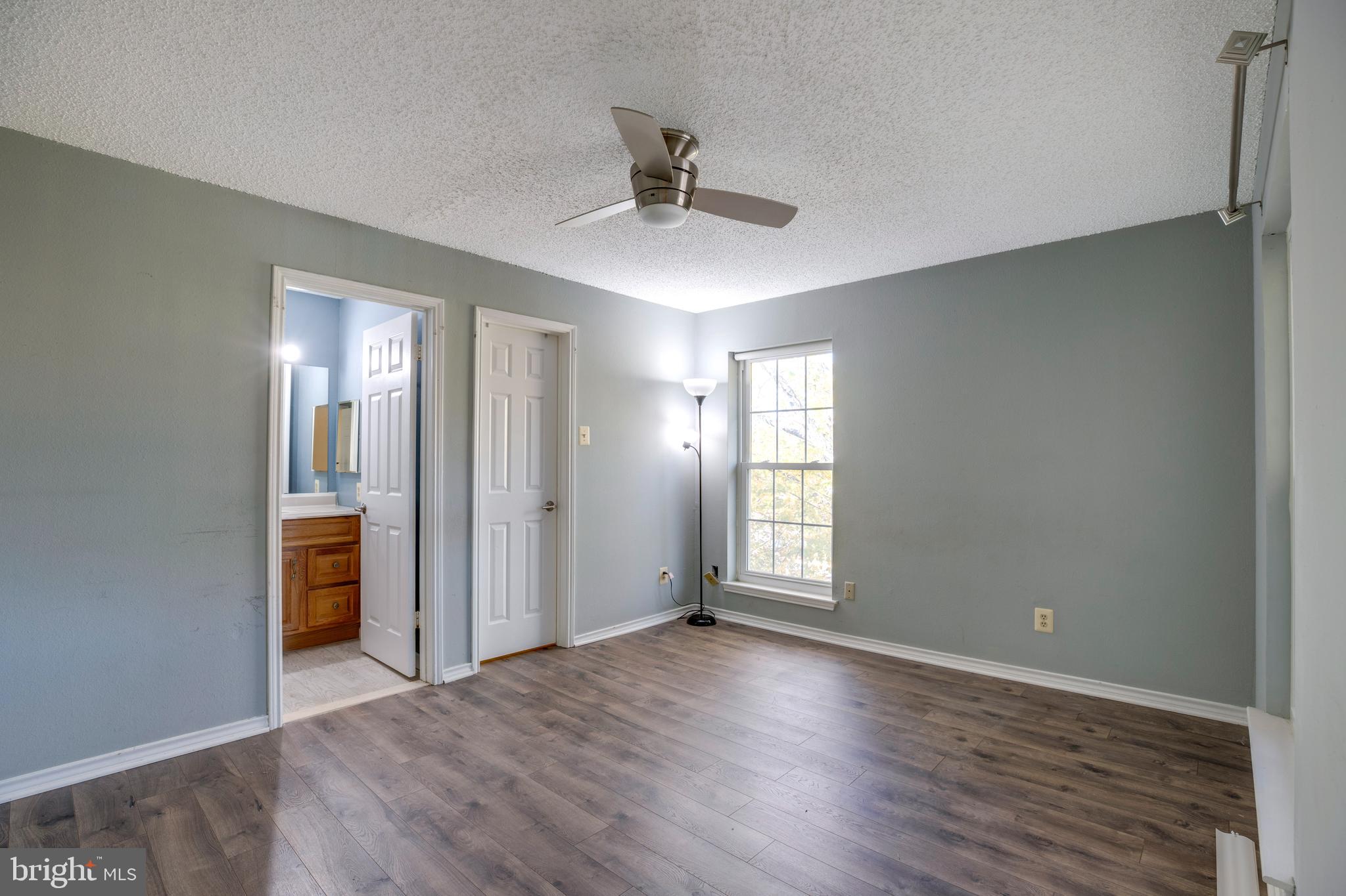 1543 Lincoln Way, Unit 301B McLean, VA 22102 - Photo 20 of 30 a view of an empty room with window and wooden floor