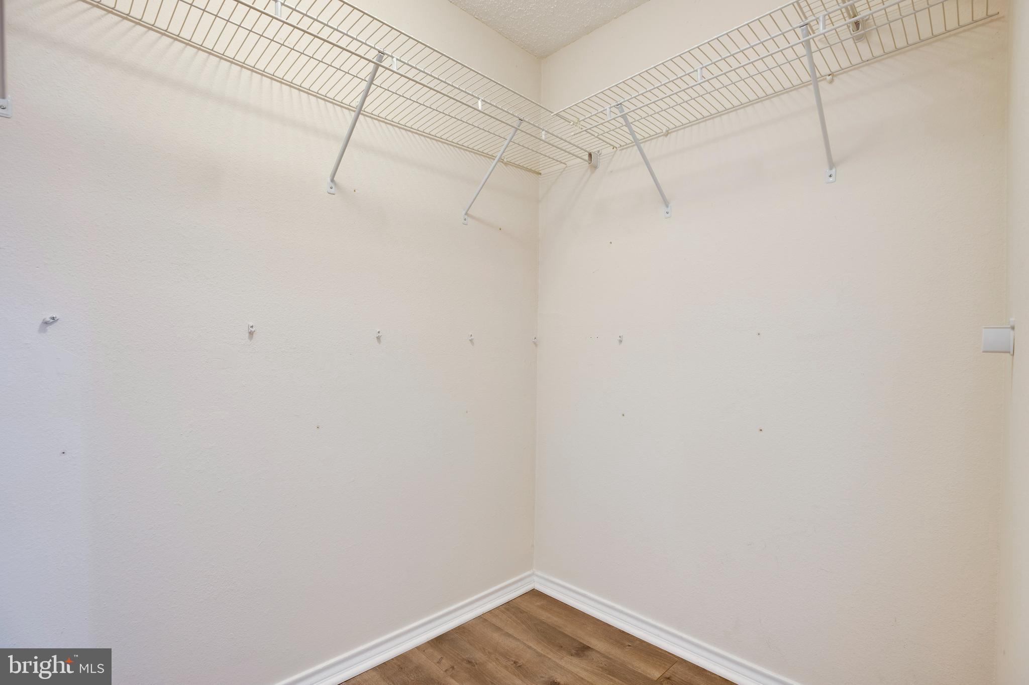 1543 Lincoln Way, Unit 301B McLean, VA 22102 - Photo 23 of 30 a view of a room with racks on the wall