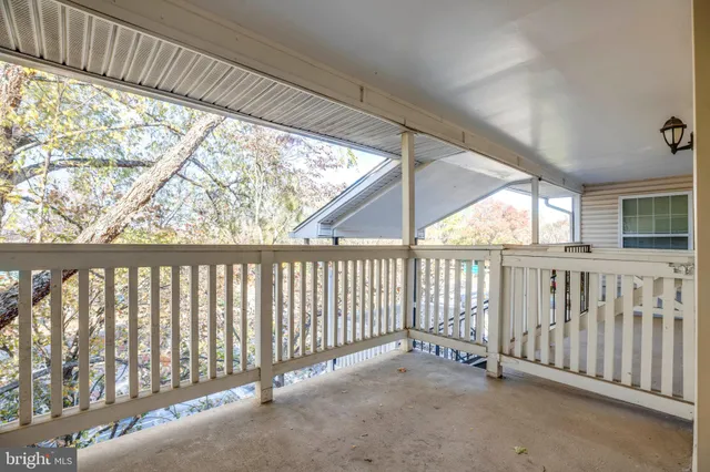 a view of a porch with wooden floor