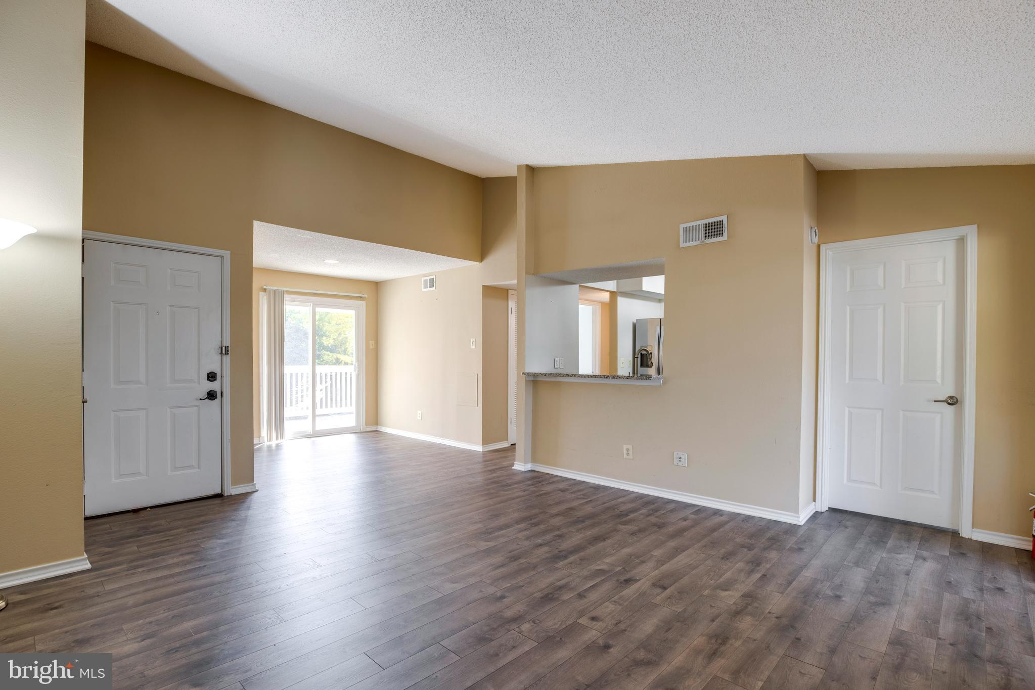 1543 Lincoln Way, Unit 301B McLean, VA 22102 - Photo 6 of 30 a view of wooden floor and windows in a room