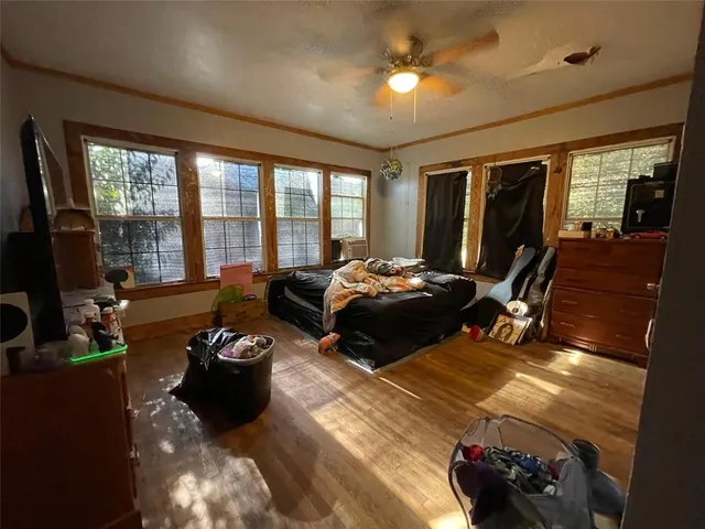 a bed room with furniture and a flat screen tv