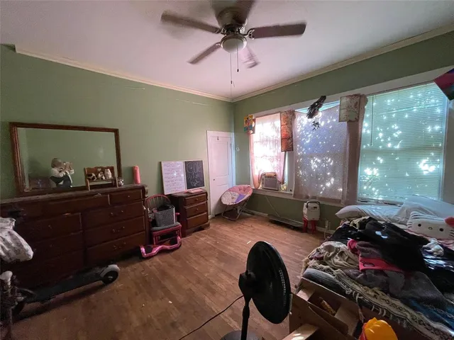 a bed room with furniture and a window