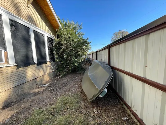 a view of a backyard with sitting area