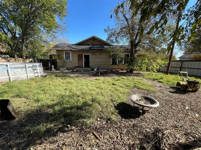 a front view of a house with yard and green space