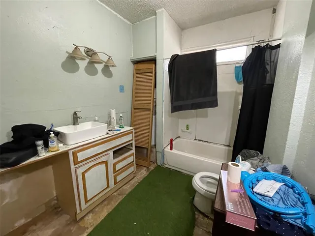 a bathroom with a sink a vanity and a mirror