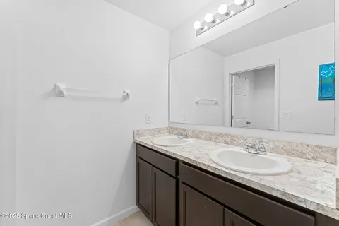 an aerial view of residential houses with outdoor space and swimming pool