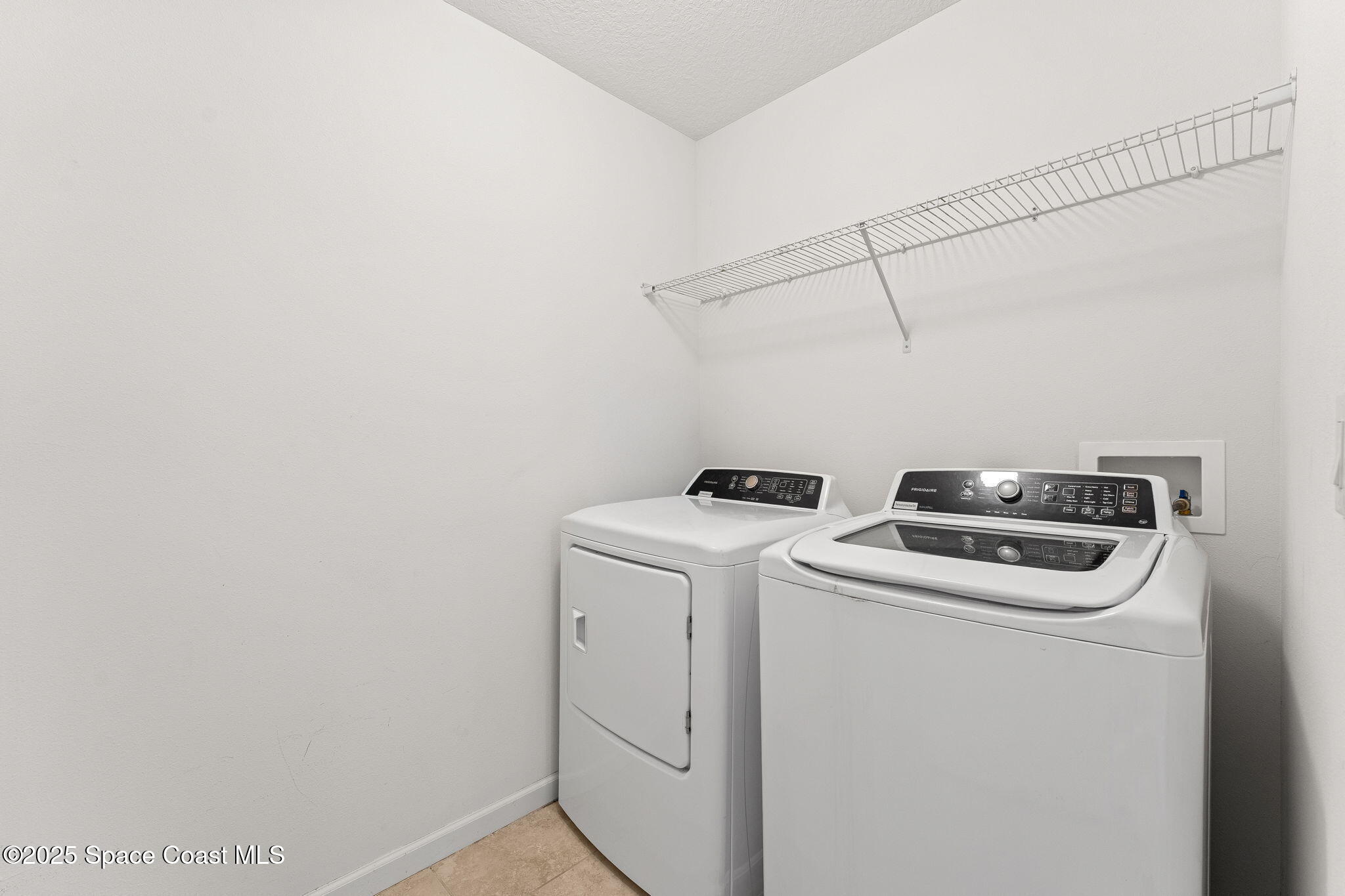 262 Alamere Drive Southwest Palm Bay, FL 32908 - Photo 22 of 34 a utility room with dryer and washer