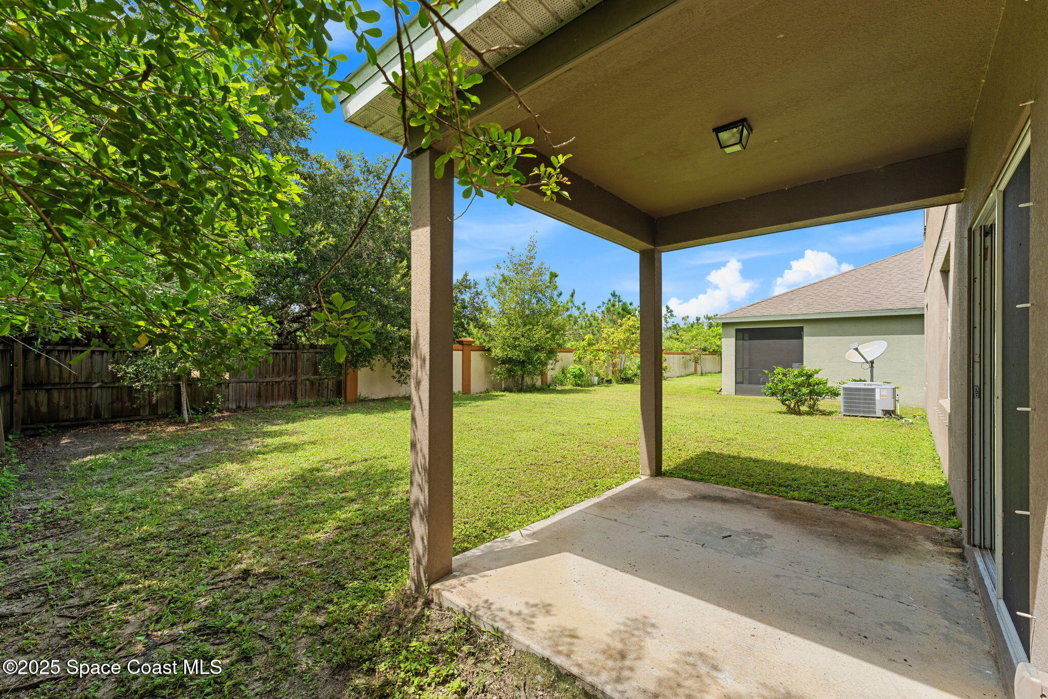 262 Alamere Drive Southwest Palm Bay, FL 32908 - Photo 26 of 34 a view of a house with backyard and porch