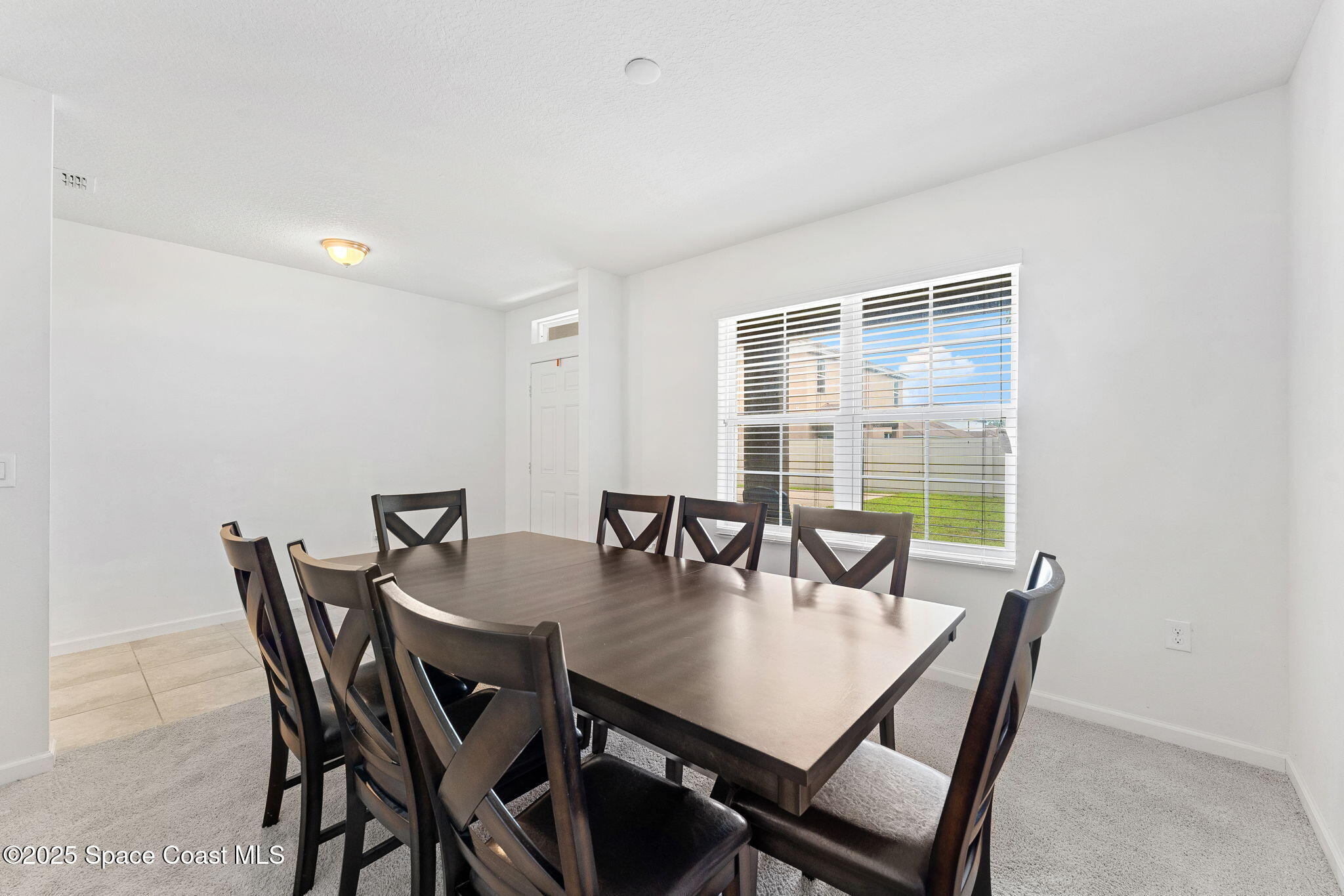 262 Alamere Drive Southwest Palm Bay, FL 32908 - Photo 4 of 34 a view of a dining room with furniture and window