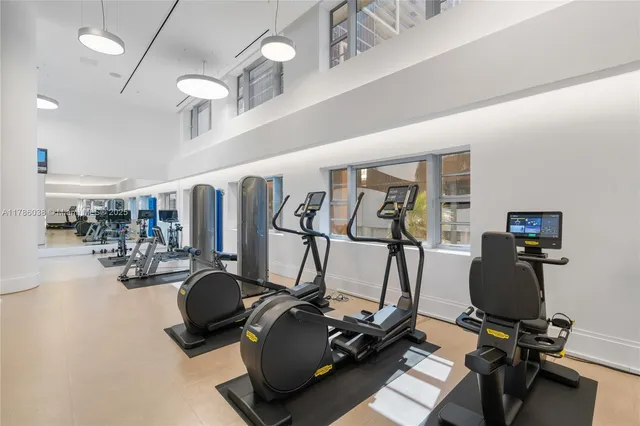 a living room with furniture and flowers