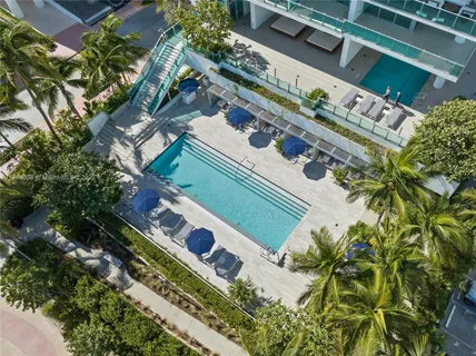 a view of swimming pool with a yard