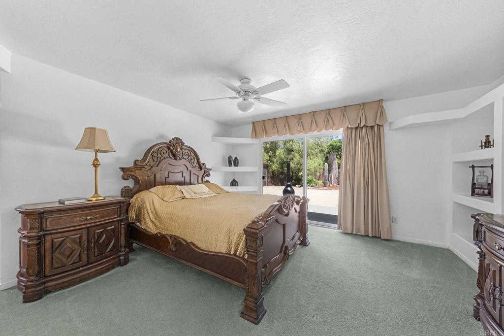 30265 Miller Road Valley Center, CA 92082 - Photo 26 of 56 a bed sitting in a spacious bedroom next to a window