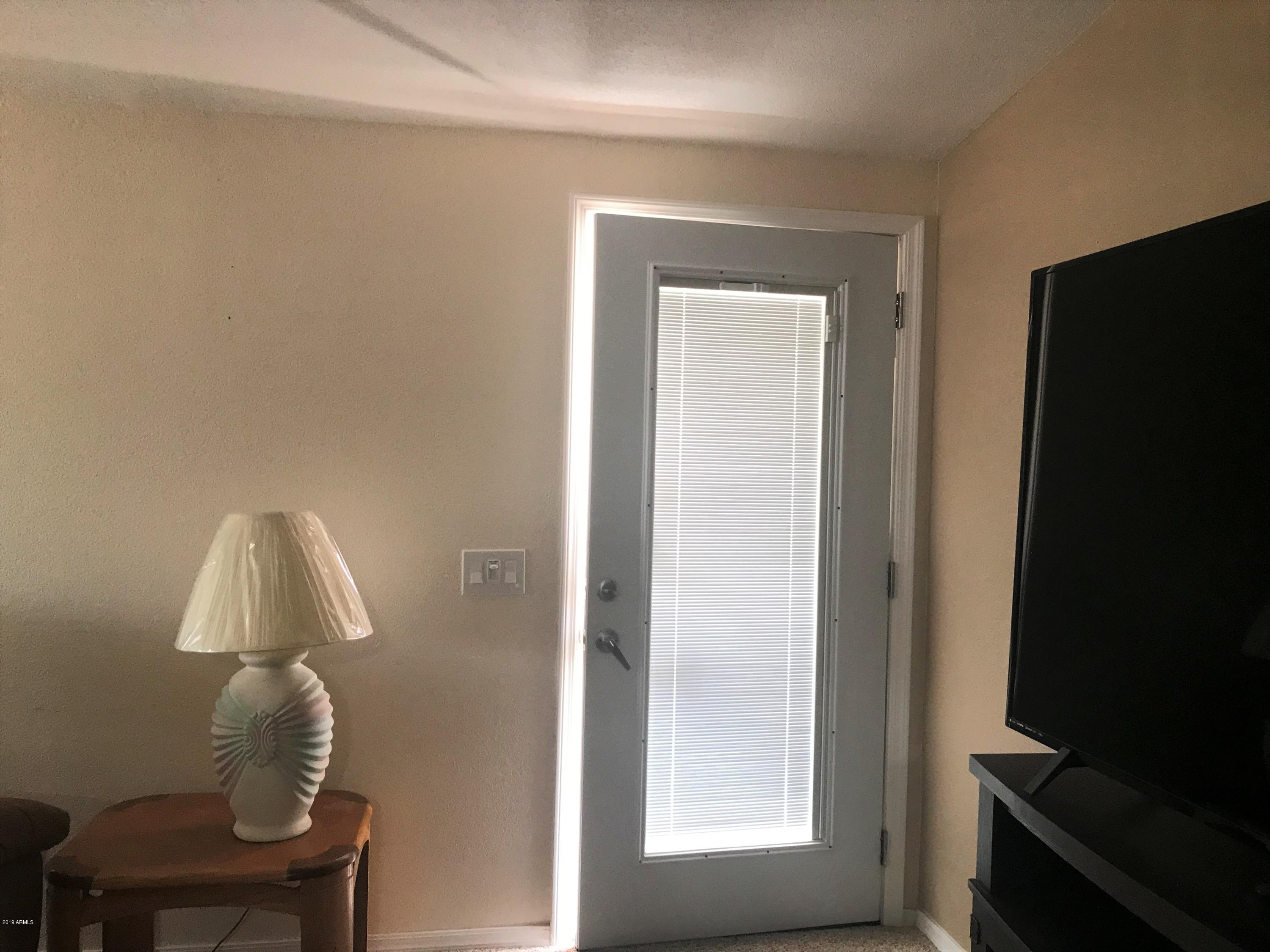 3500 South Tomahawk Road, Unit 204 Apache Junction, AZ 85119 - Photo 7 of 46 Front door with inside blinds