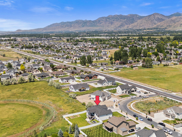 3111 South 1250 West Logan, UT 84321 - Photo 51 of 51 Aerial perspective showcasing a residential neighborhood with mountain backdrop