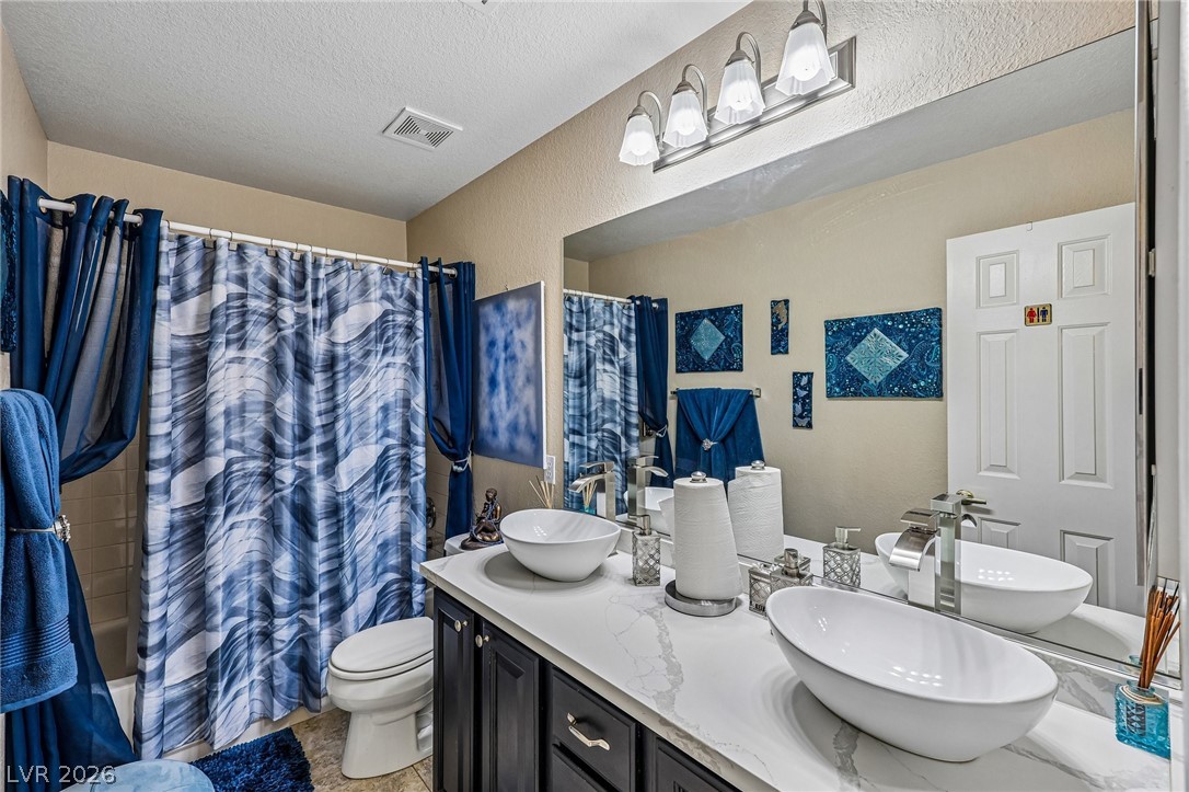 5236 Saranac Road Las Vegas, NV 89130 - Photo 36 of 52 Upstairs Guest Bath with double vanity