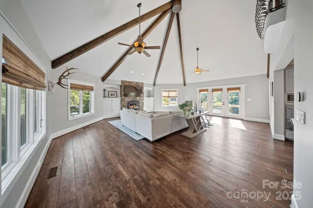 a living room with hardwood floor and windows