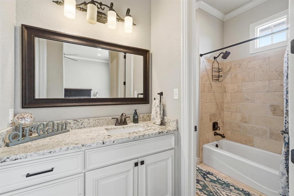 249 Rising Star Drive Abilene, TX 79606 - Photo 25 of 40 a bathroom with a granite countertop sink mirror and a bathtub