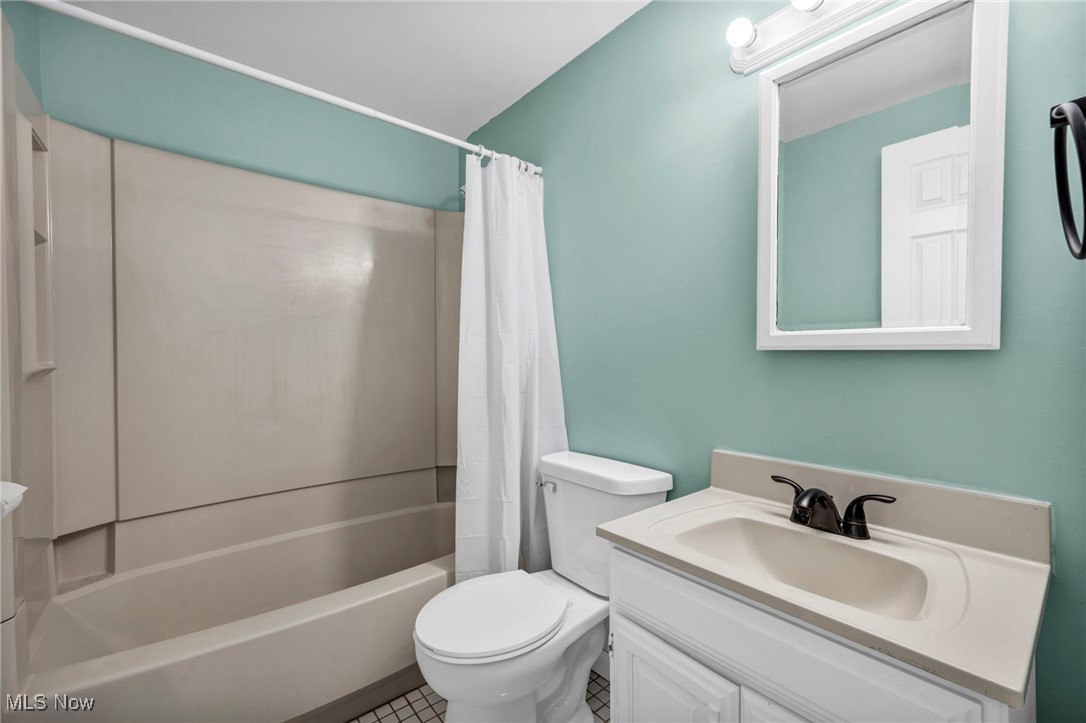 1135 Keefer Road Girard, OH 44420 - Photo 21 of 32 Full bath with shower / bath combo, vanity, and tile patterned floors