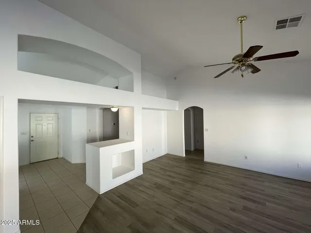 a view of an empty room with a bathroom