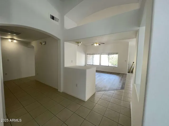 a view of an empty room and window