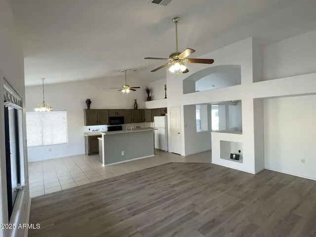 a kitchen with stainless steel appliances kitchen island a refrigerator and a stove