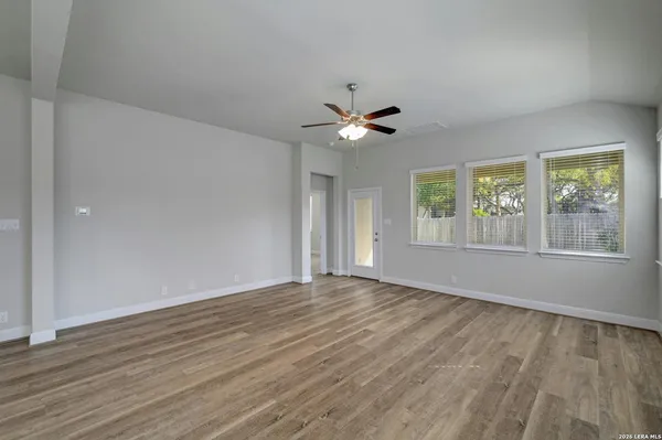 a view of an empty room with a window