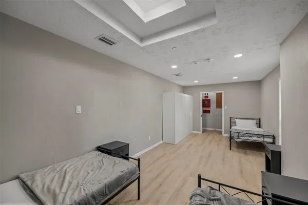 a bedroom with furniture and a bed